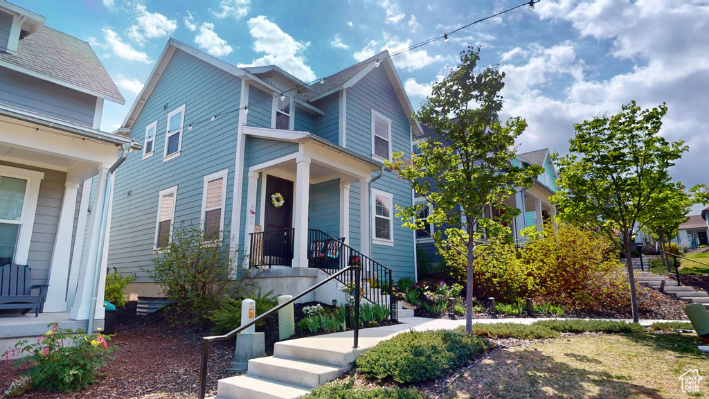 View of front of property featuring stairway