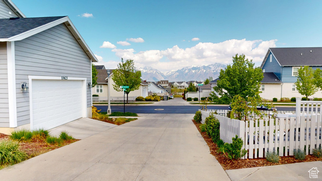 View of road featuring a residential view and a mountain view