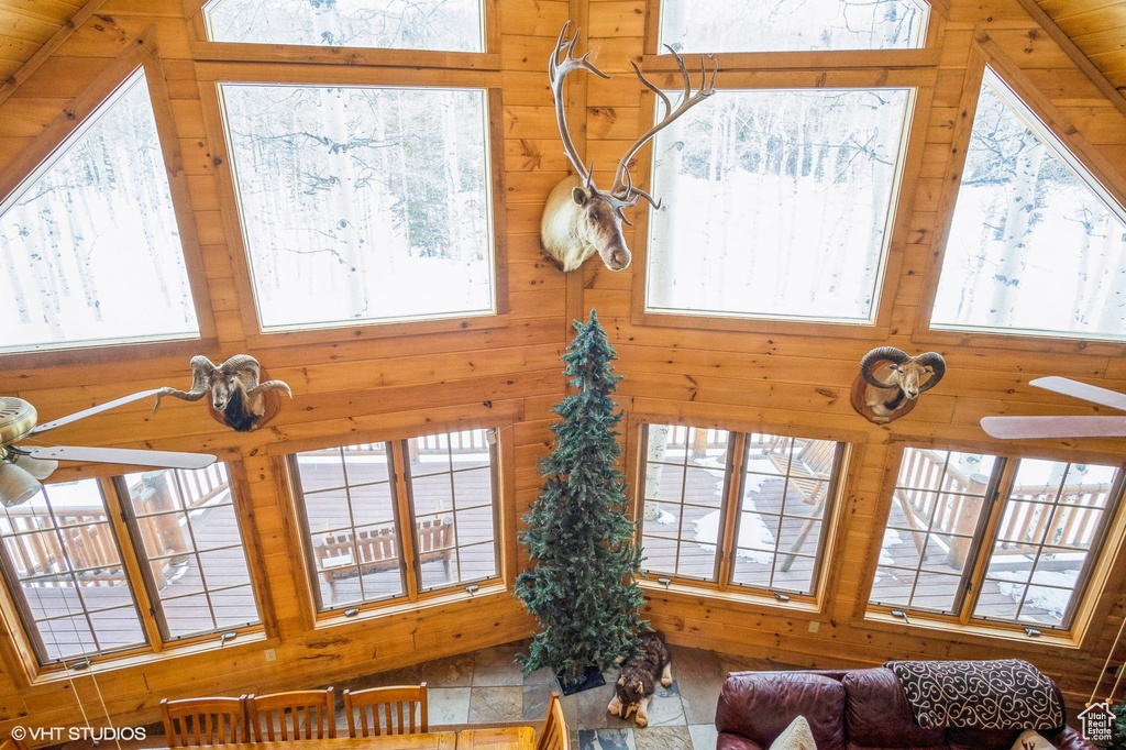 Living room featuring wooden walls