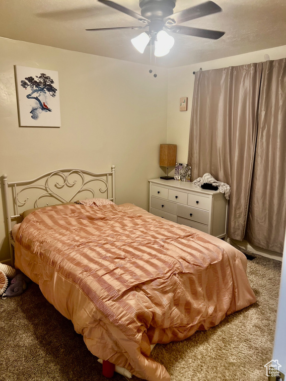 Bedroom with carpet flooring and a ceiling fan