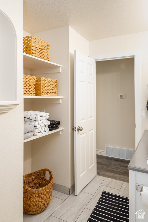 Bathroom featuring baseboards and visible vents