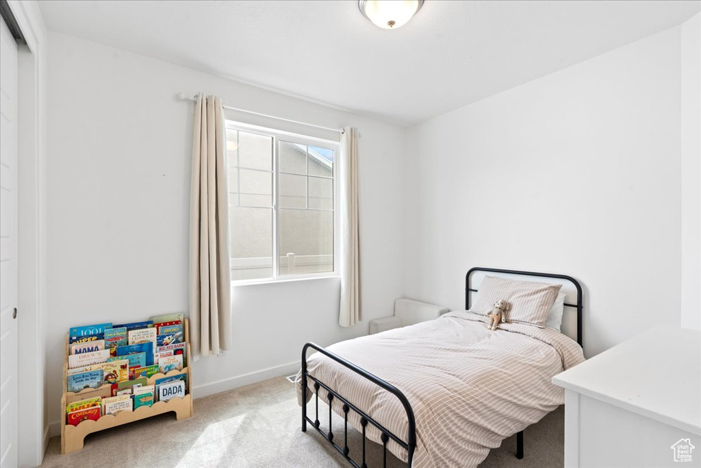 Bedroom featuring a closet and carpet flooring
