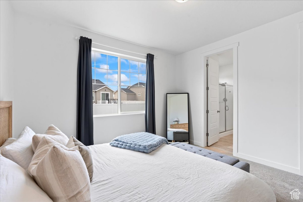 Bedroom with baseboards and carpet flooring