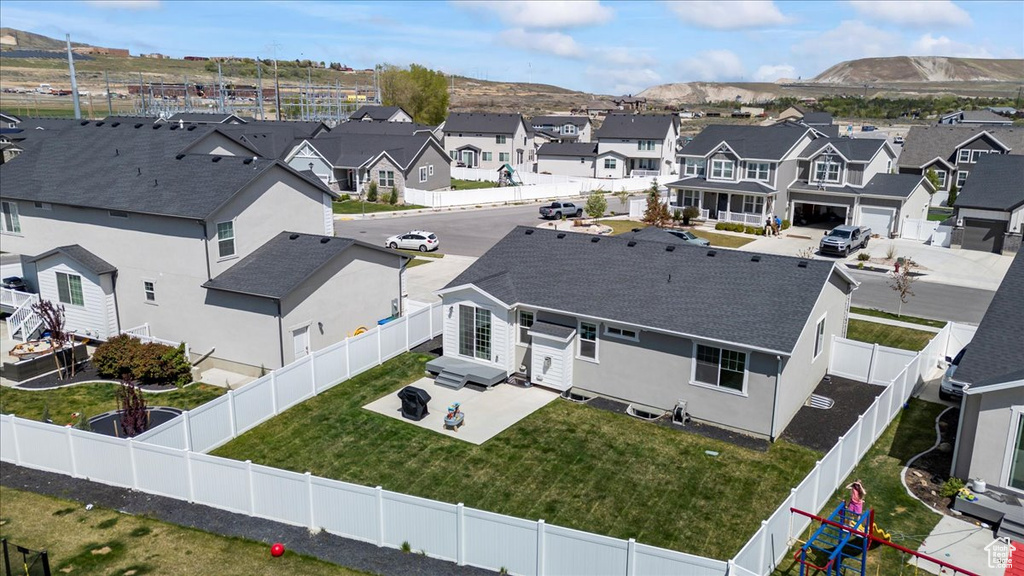 Drone / aerial view featuring a residential view and a mountain view