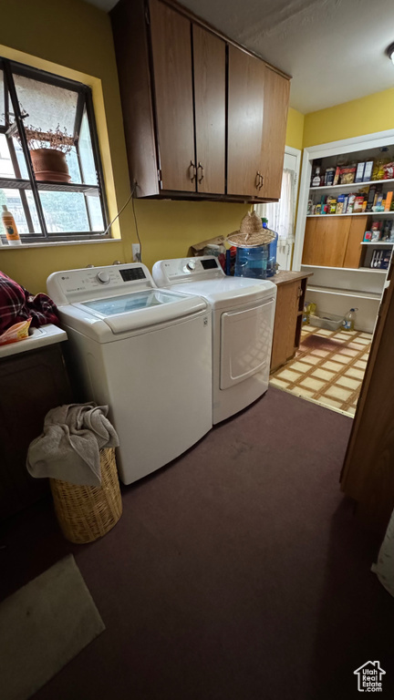 Laundry area with cabinet space and washer and dryer