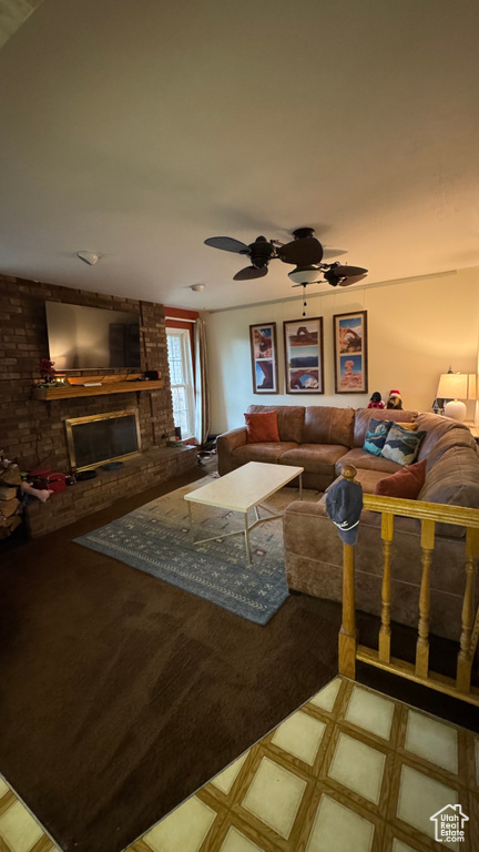 Living room with tile patterned floors and a fireplace