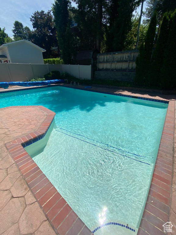 View of pool with a fenced in pool and a fenced backyard