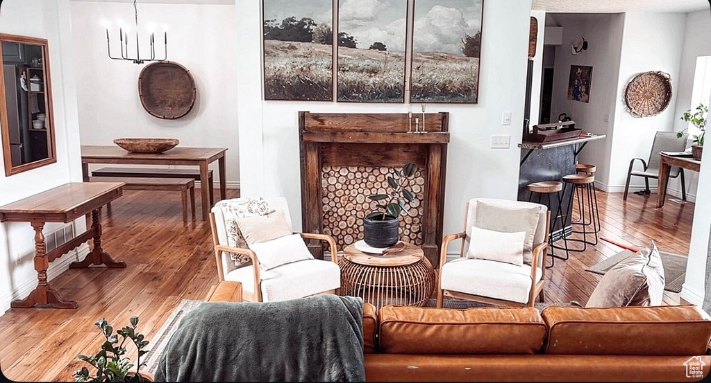 Living area featuring baseboards and hardwood / wood-style floors