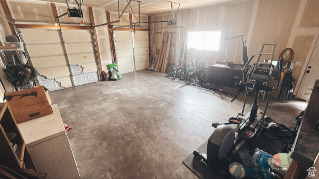 Garage featuring a garage door opener