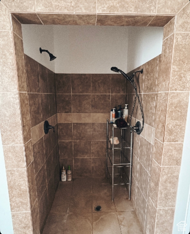 Full bath featuring a tile shower