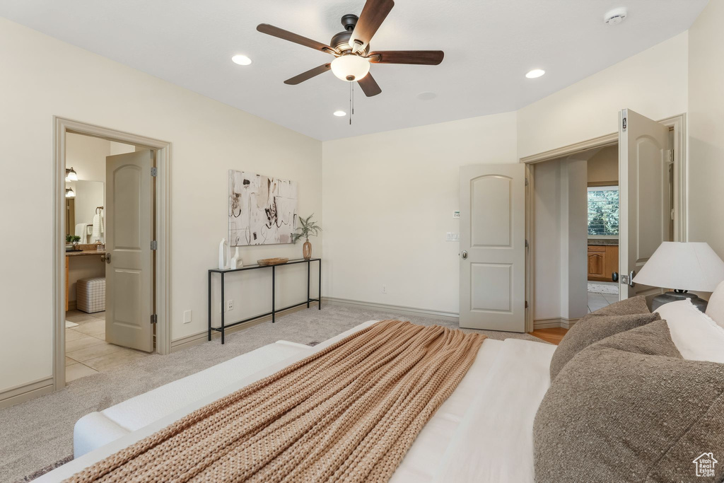 Bedroom with recessed lighting, baseboards, and light carpet