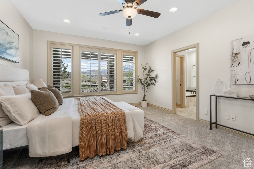 Bedroom with a ceiling fan, baseboards, ensuite bathroom, recessed lighting, and carpet flooring