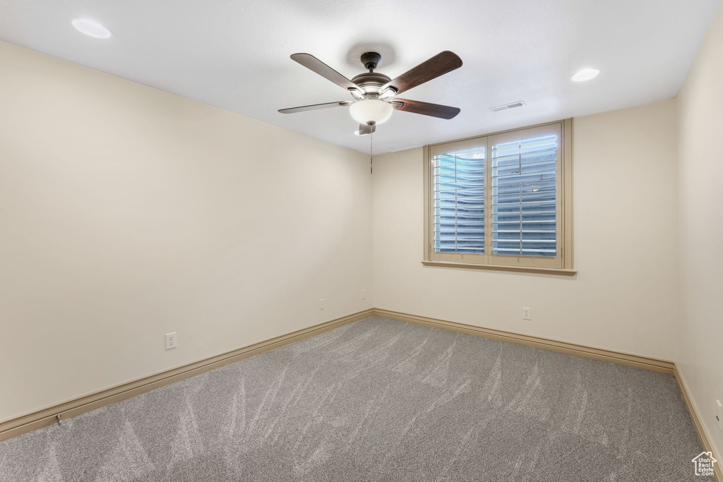 Unfurnished room featuring visible vents, carpet floors, baseboards, recessed lighting, and a ceiling fan
