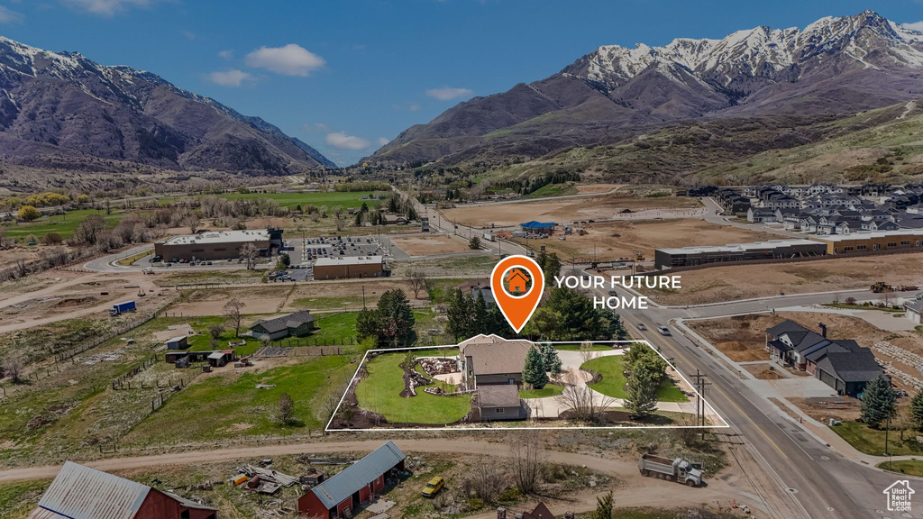 Birds eye view of property with a mountain view