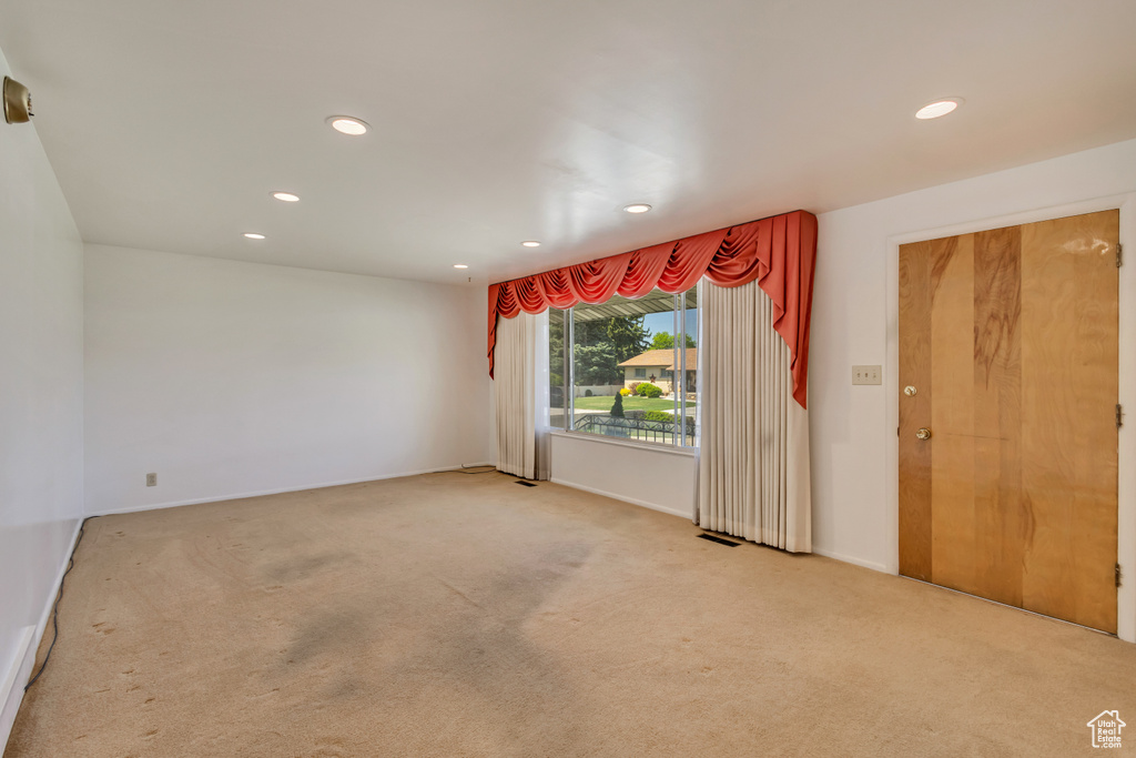 Spare room featuring carpet floors and recessed lighting