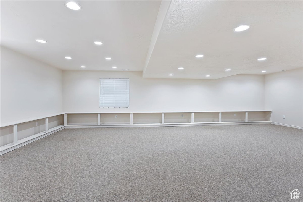 Empty room featuring carpet floors and recessed lighting
