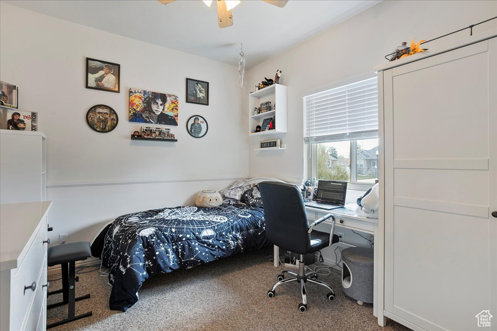 Bedroom with carpet and ceiling fan
