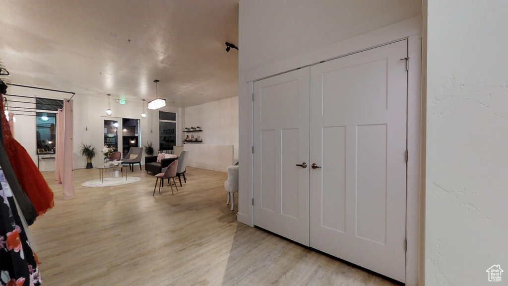 Hallway with light wood-style flooring