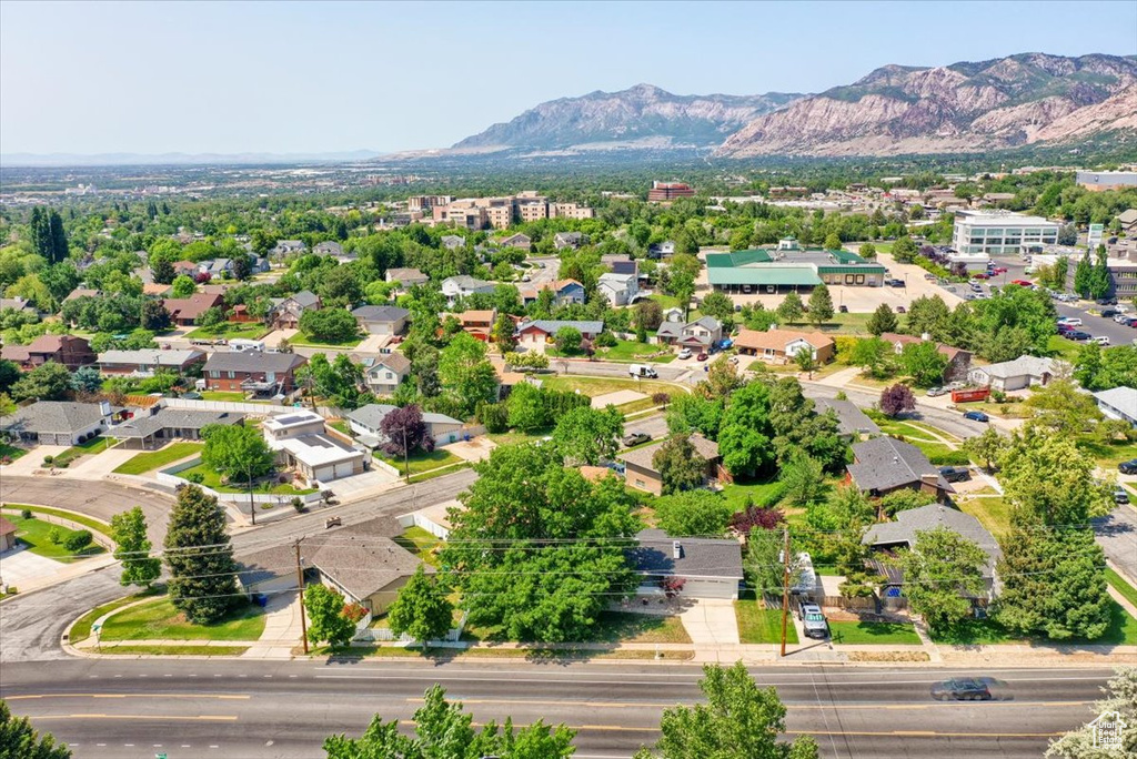 Aerial view of residential area featuring a mountain backdrop