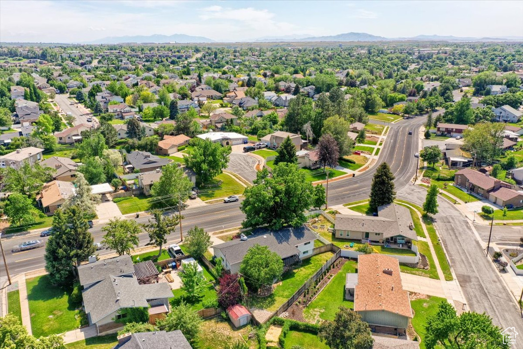 Aerial perspective of suburban area with a mountainous background