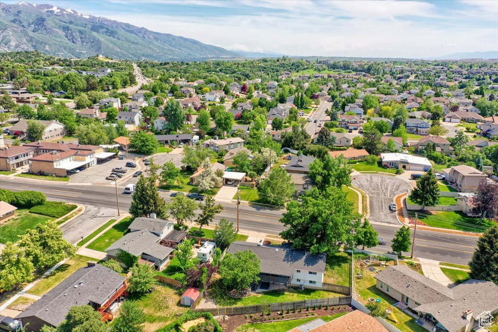 Aerial view of residential area featuring mountains