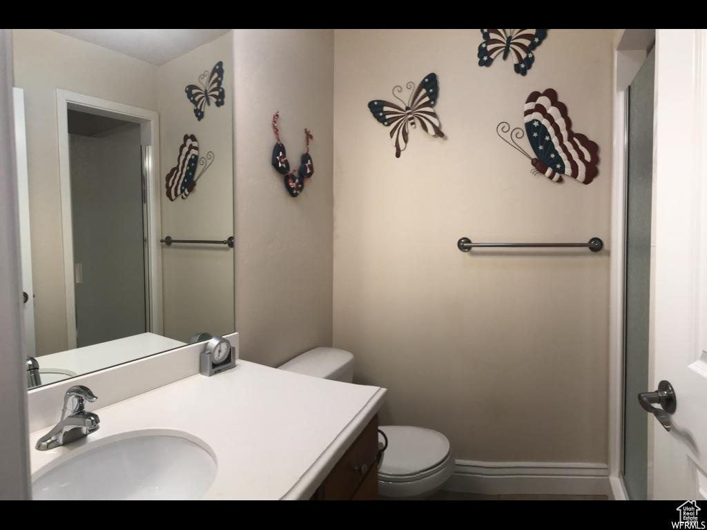 Bathroom featuring vanity and toilet