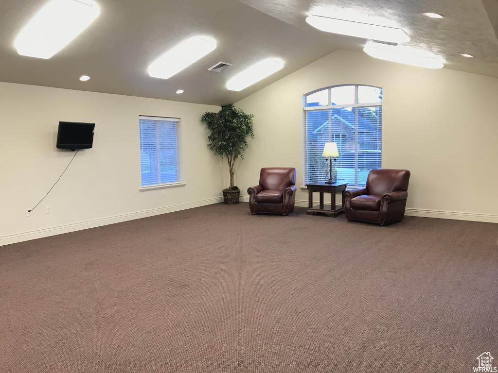 Sitting room with visible vents, baseboards, recessed lighting, carpet flooring, and vaulted ceiling