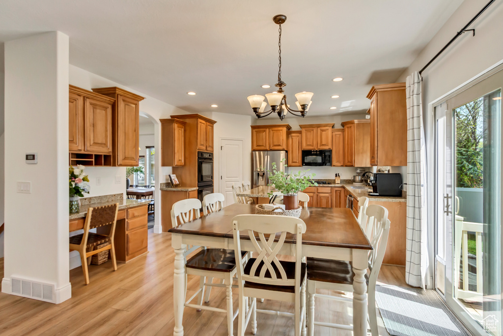 Dining area featuring recessed lighting, visible vents, light wood-style flooring, and a healthy amount of sunlight