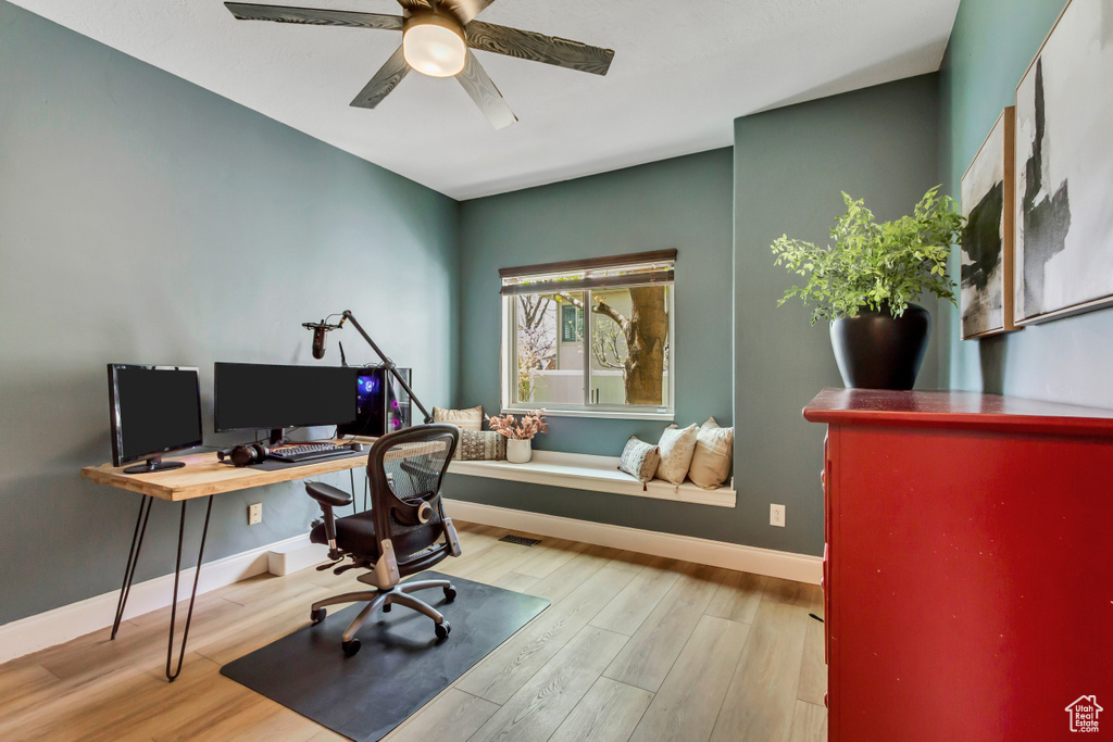 Office featuring wood finished floors, a ceiling fan, and baseboards