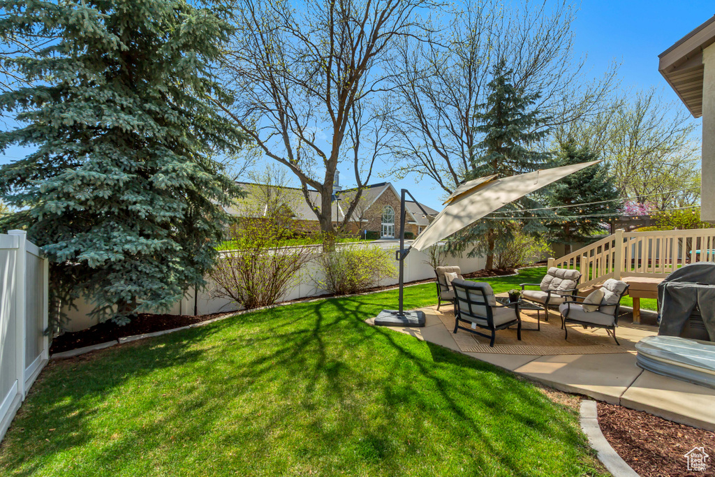View of yard with an outdoor hangout area, a fenced backyard, and a patio area