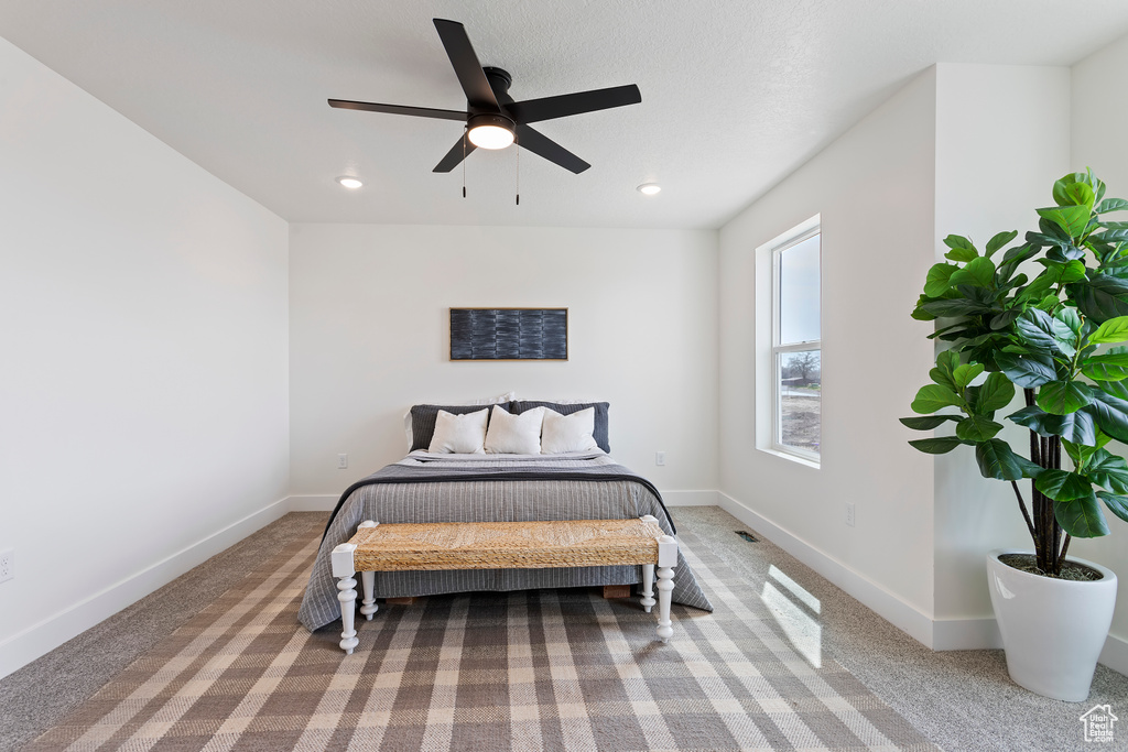 Carpeted bedroom featuring recessed lighting, baseboards, and ceiling fan
