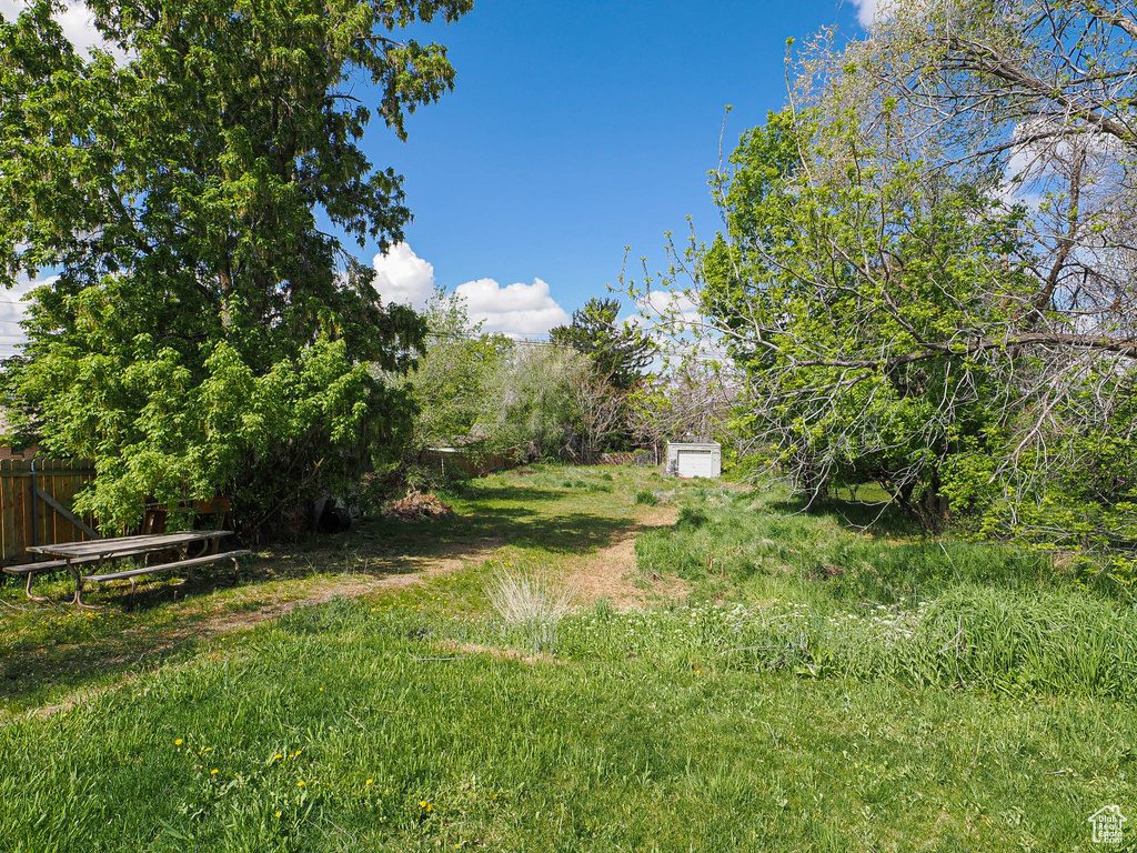 View of yard featuring fence