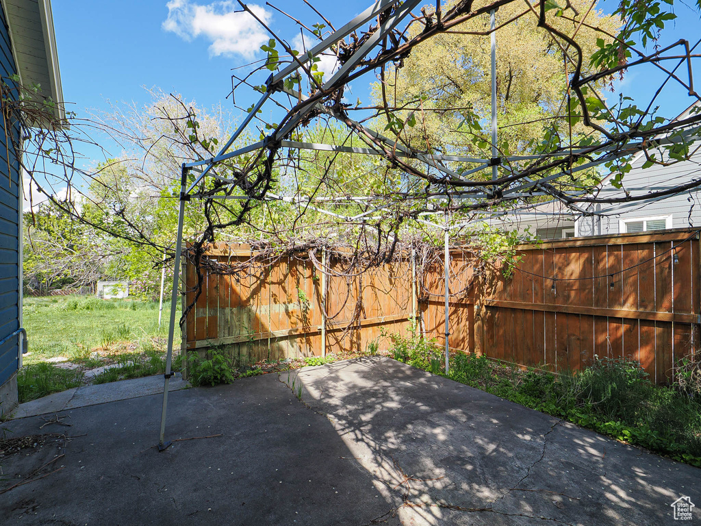 View of patio with fence