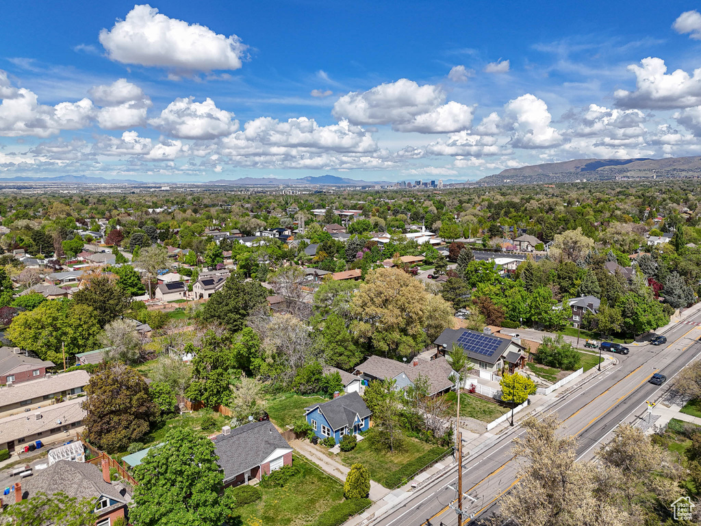Birds eye view of property with a residential view and a mountain view