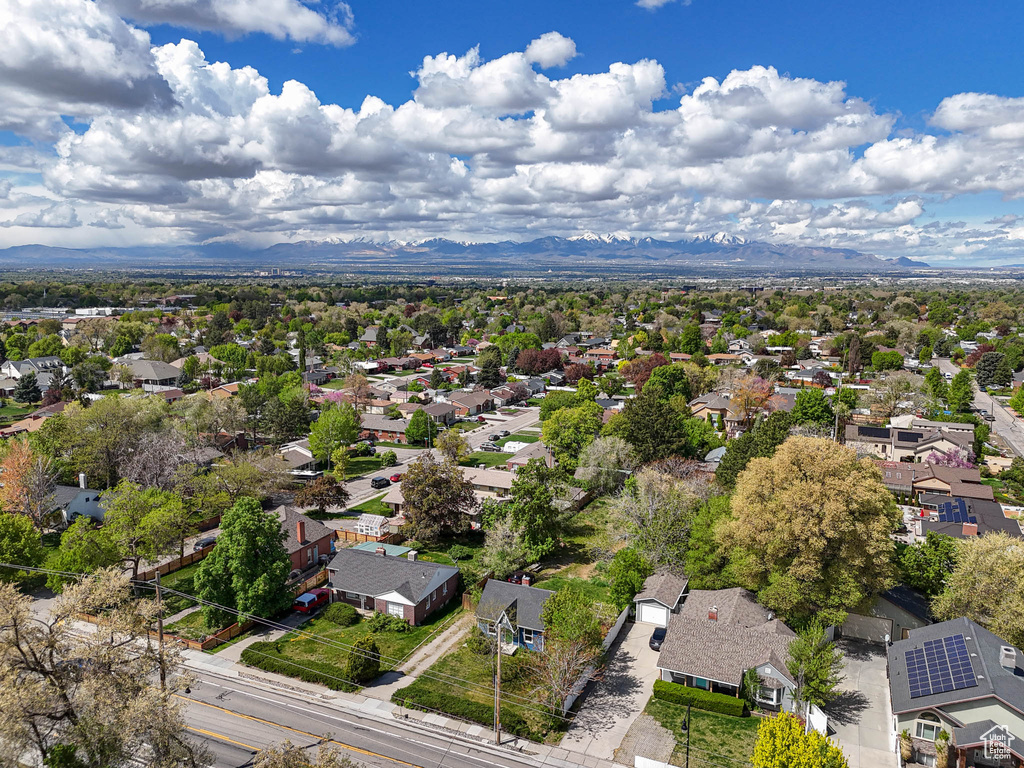 Birds eye view of property with a residential view and a mountain view