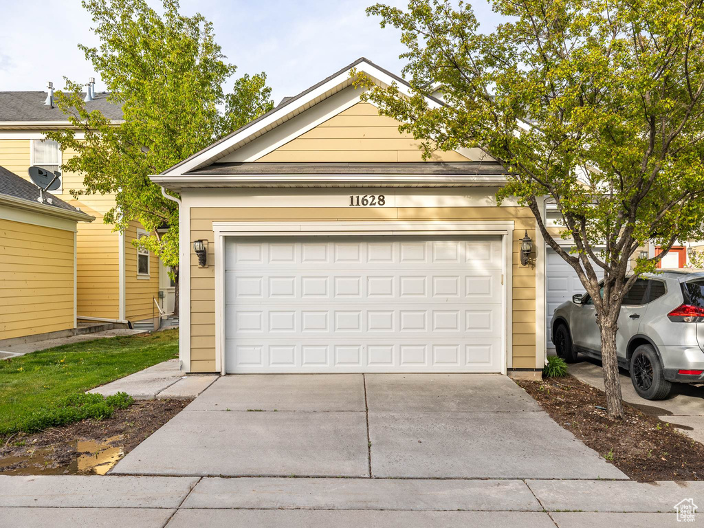 Garage with concrete driveway
