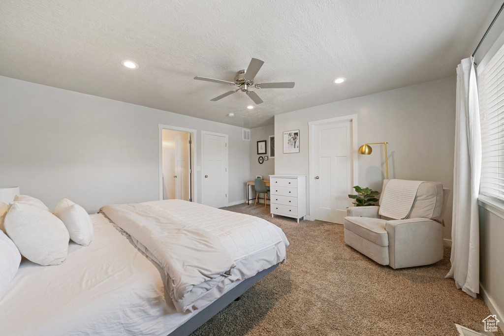 Bedroom featuring a ceiling fan, visible vents, baseboards, light carpet, and recessed lighting