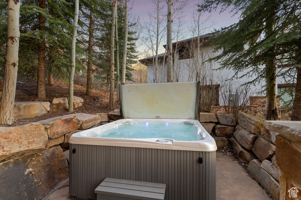 Exterior space with a hot tub