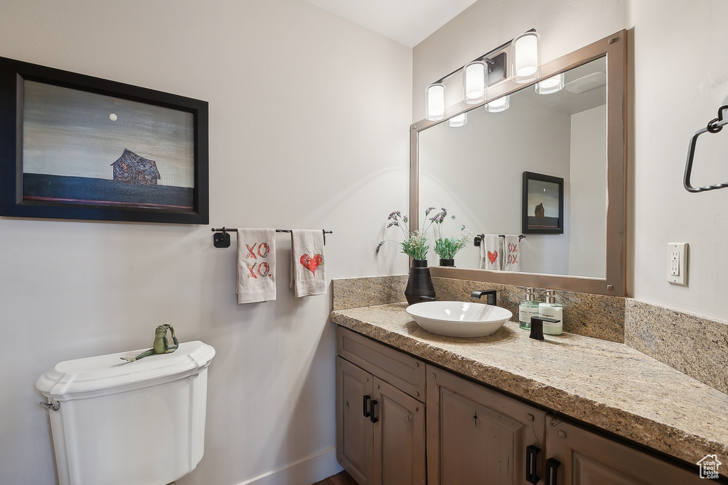 Bathroom featuring vanity and toilet