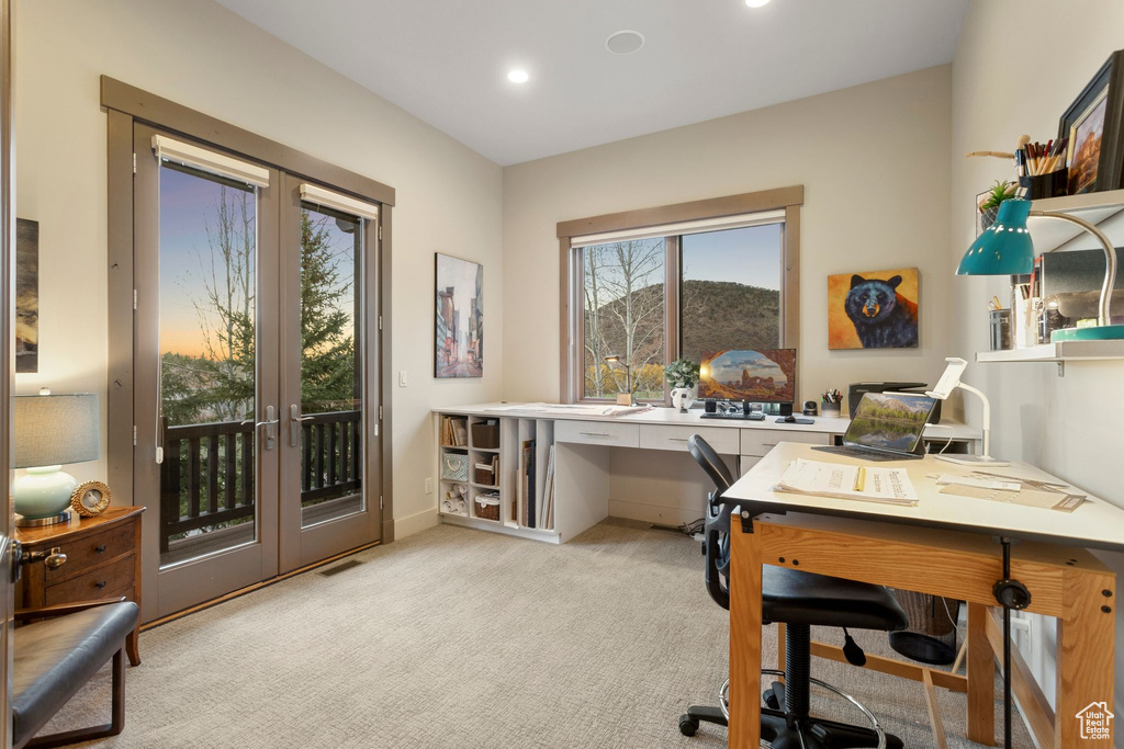 Home office featuring visible vents, french doors, recessed lighting, and light colored carpet