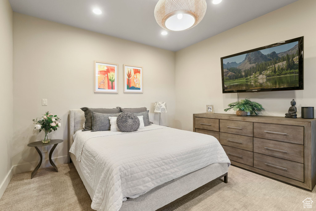 Bedroom with baseboards, recessed lighting, and light carpet
