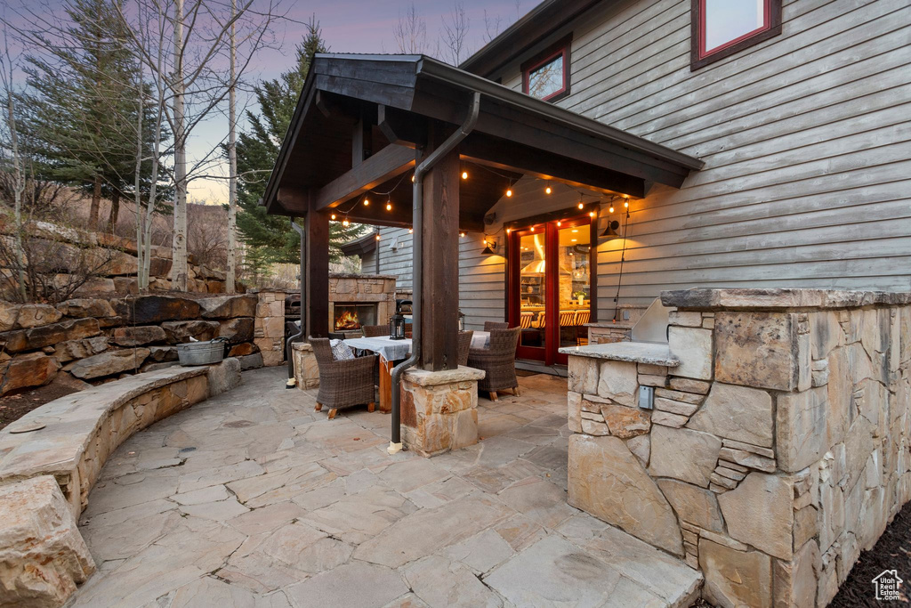 View of patio / terrace with an outdoor stone fireplace