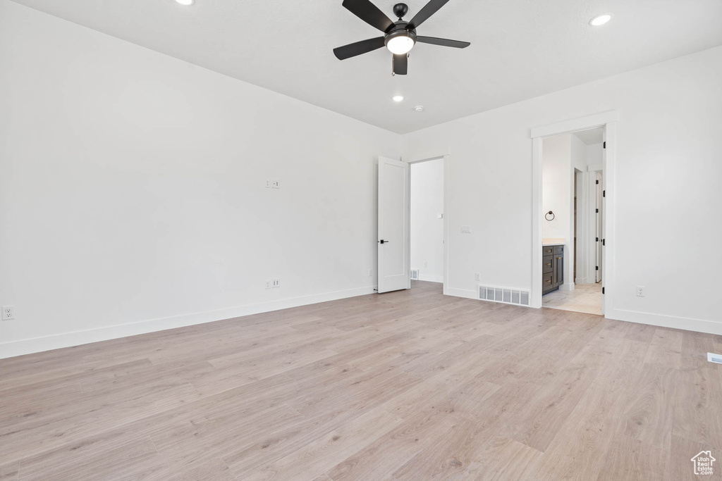 Unfurnished bedroom featuring visible vents, recessed lighting, light wood-style flooring, and baseboards