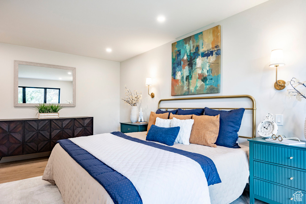 Bedroom with recessed lighting and wood finished floors