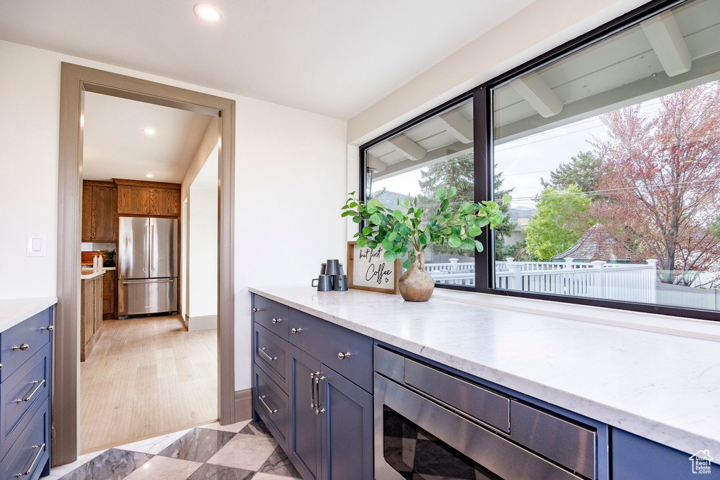 Interior space featuring recessed lighting and appliances with stainless steel finishes
