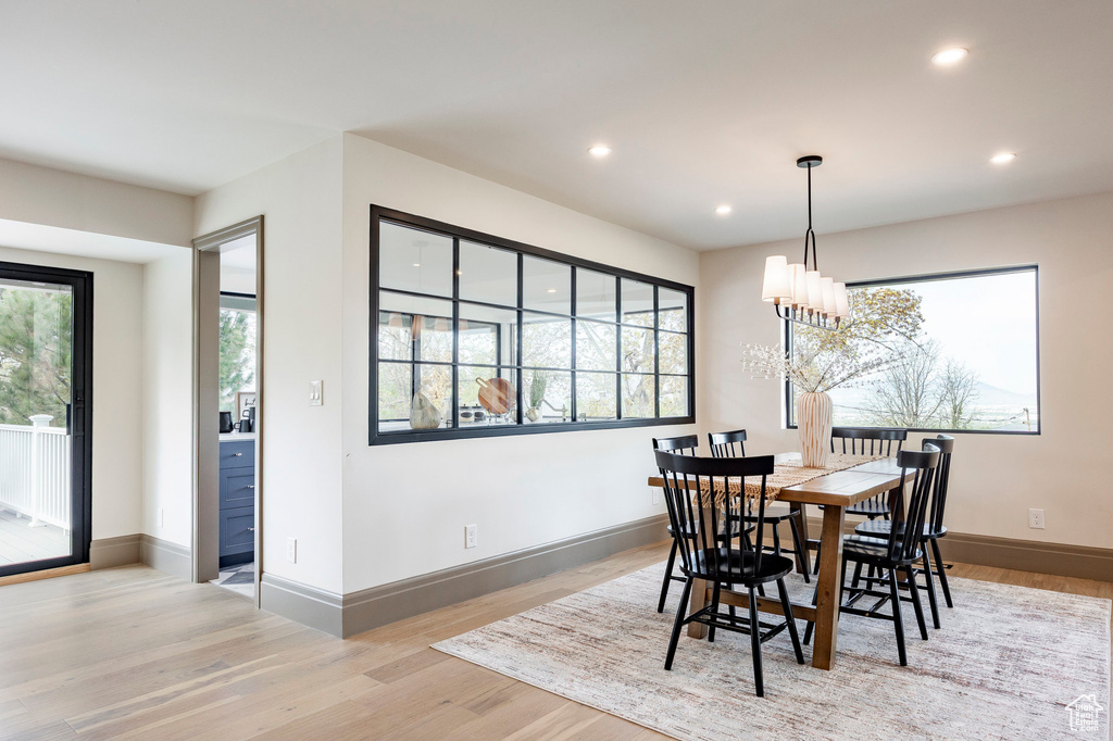 Dining area featuring recessed lighting, light wood-style flooring, and baseboards