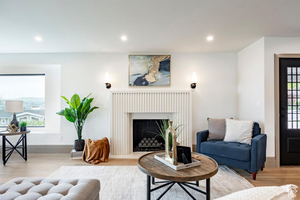 Living area with recessed lighting and wood finished floors