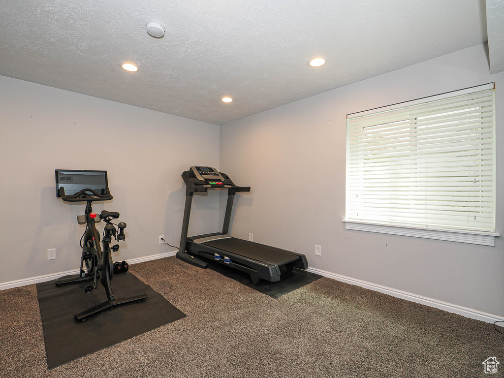 Exercise area featuring recessed lighting, baseboards, and carpet