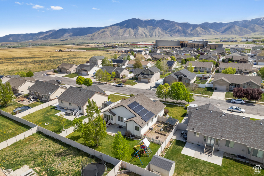 Birds eye view of property with a residential view and a mountain view