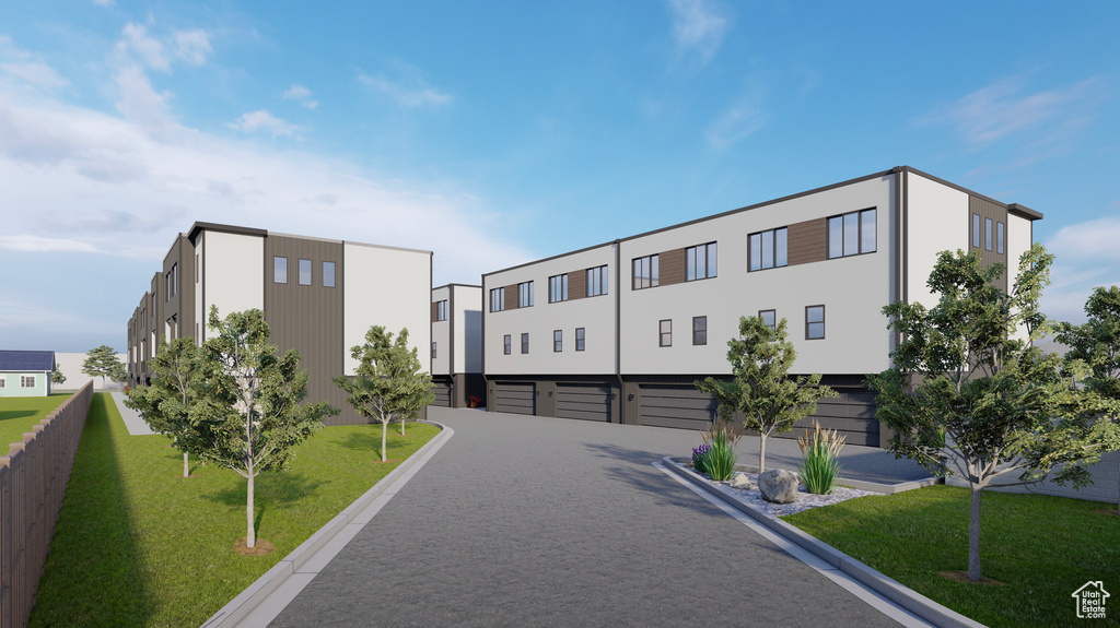Exterior space featuring a garage and driveway